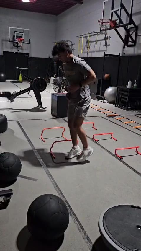 A client stepping over agility hurdles