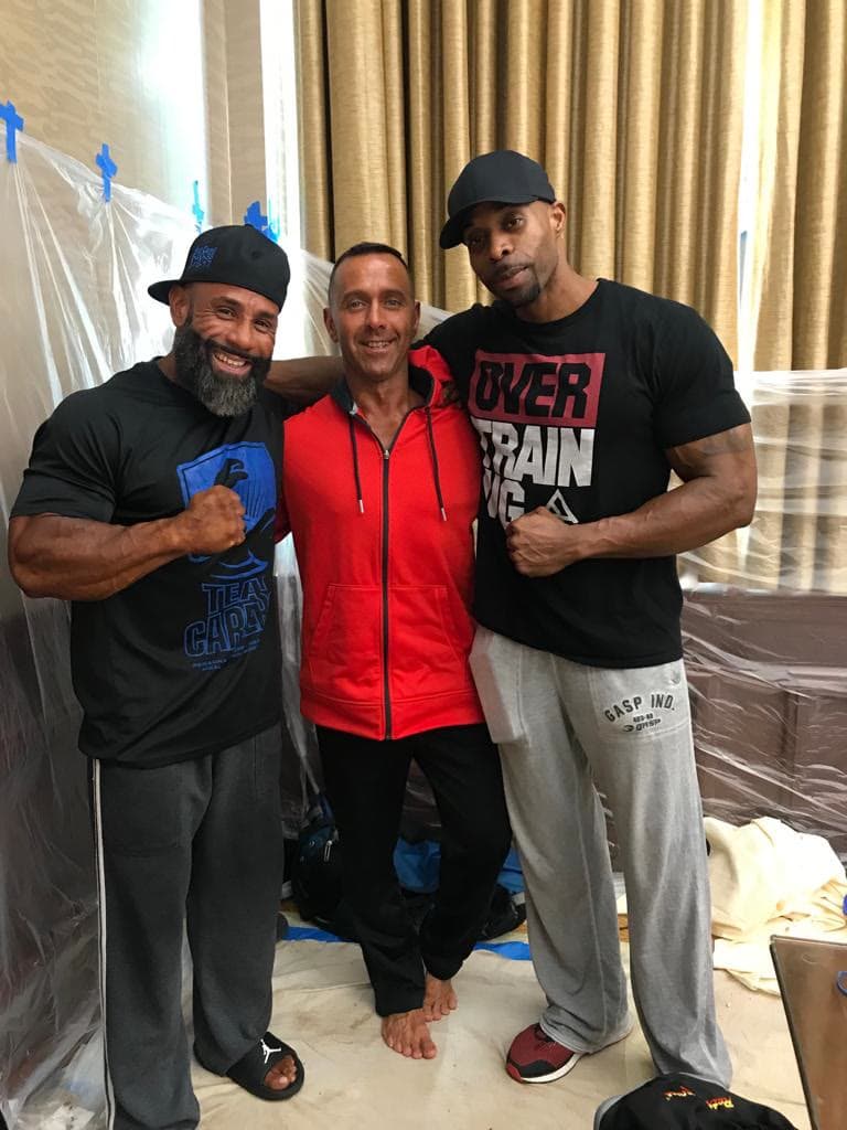 Daine Chang with two training partners in a gym